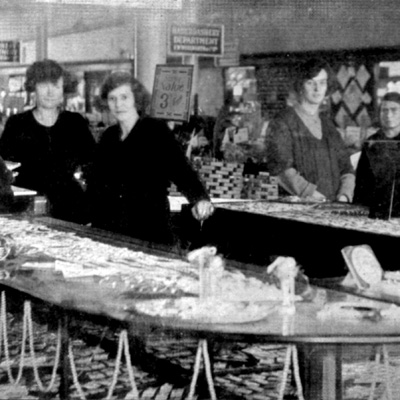 The Jewellery Counter girls serving members of the public in the High Road, Ilford store. This elegant fixture, dating from the 1920s was rare and considered too upmarket by Company bosses - but they were too tight to replace the ones already in place! Click for a larger version in a new window.